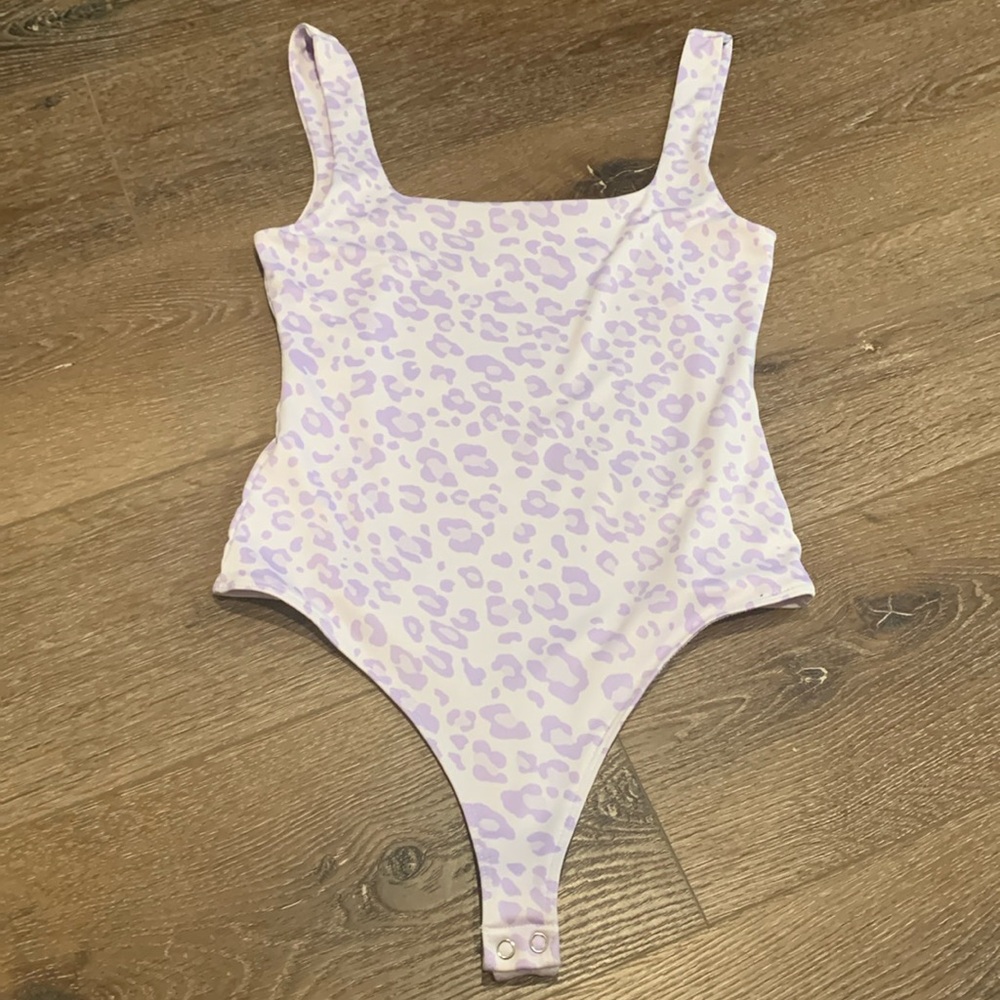 Madeline & Monroe Leopard Print Bodysuit. Purple and white leopard print. Medium